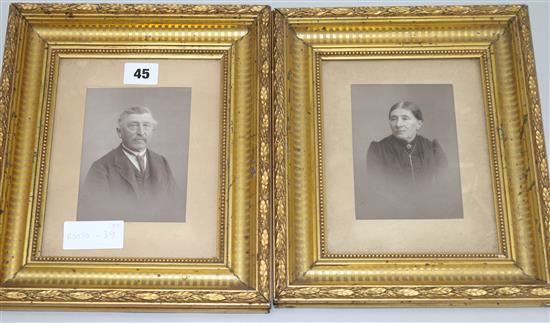 A pair of gilt framed black and white photographs